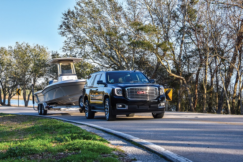 GMC SUV pulling a boat