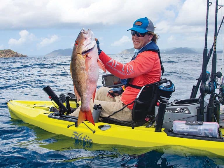 Kayak angler catching snapper