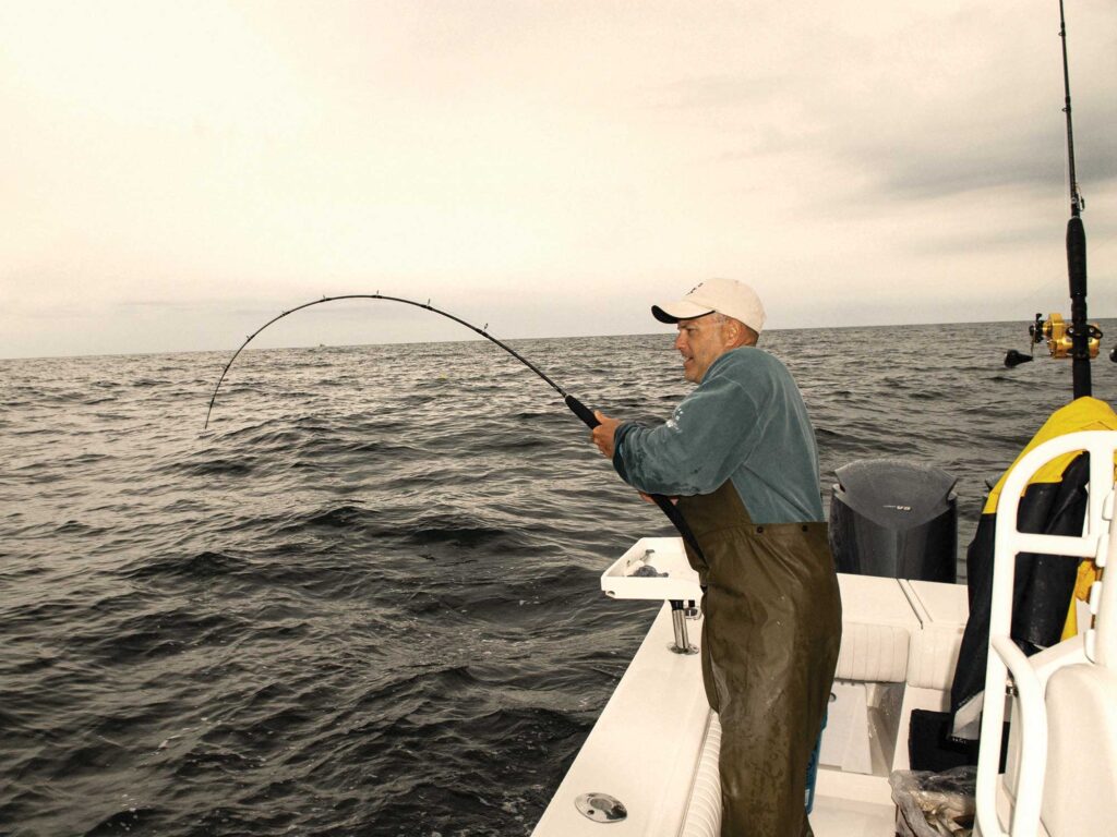 Angler reeling in a tuna