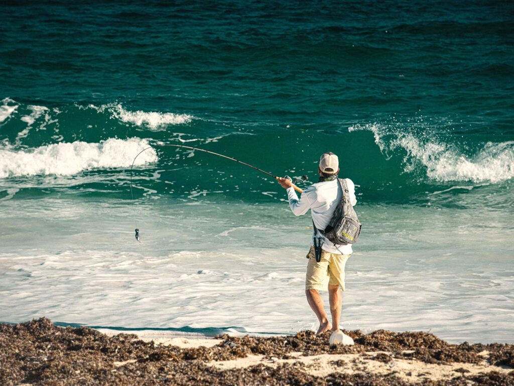 Angler casting a travel rod