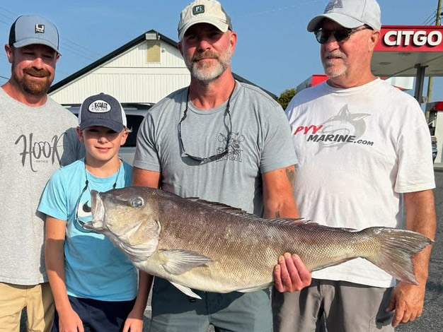 Group of anglers with a man holding the new Maryland state record blueline tilefish.