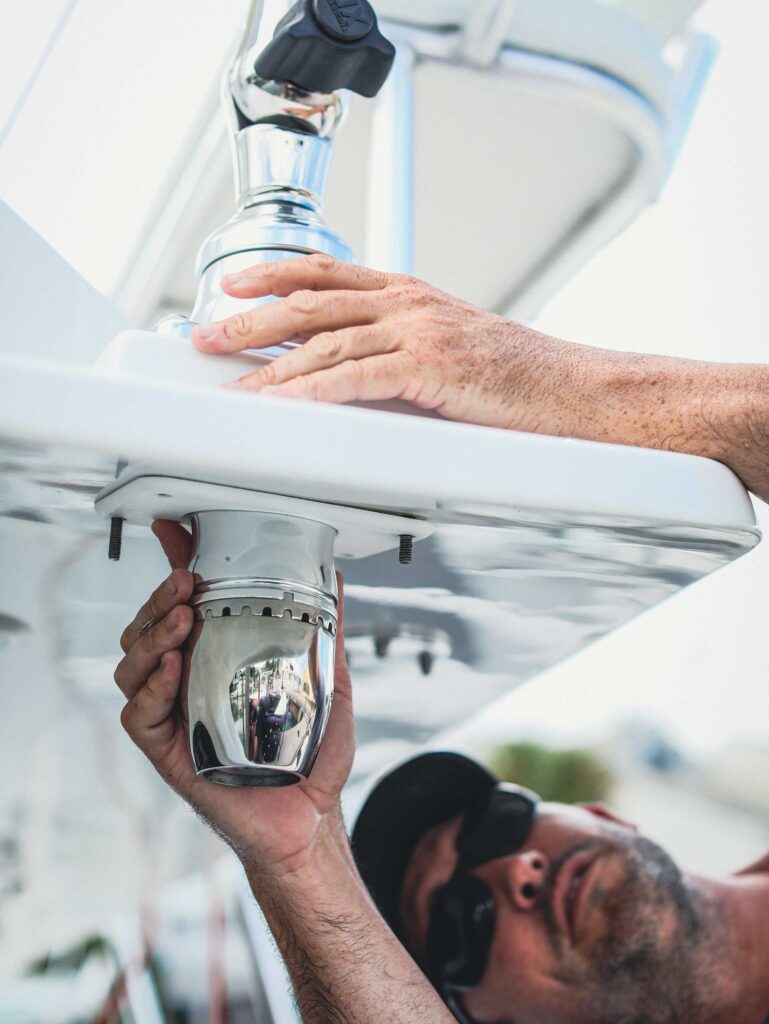 Installer adding boat accessories