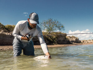 Angler catching a fish using a baitcaster