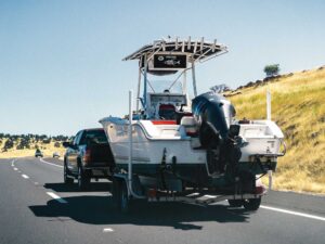 Fishing boat being towed