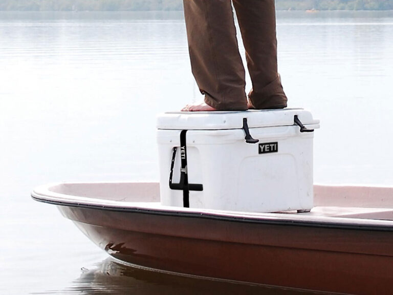 Angler standing on a cooler