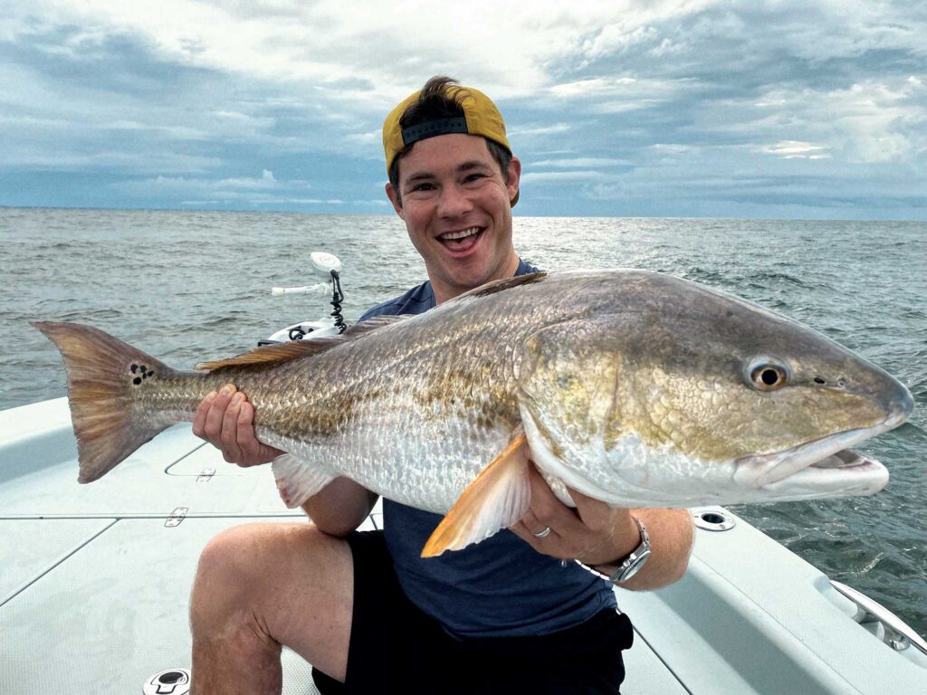 Angler with a bull red