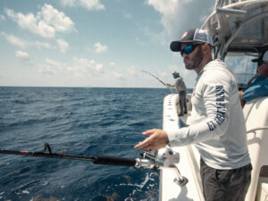 Angler fishing with a Penn Fathom electric reel