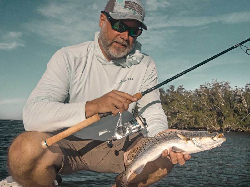 SWS824-Small-Spinning-Reels-1 Angler holding a seatrout